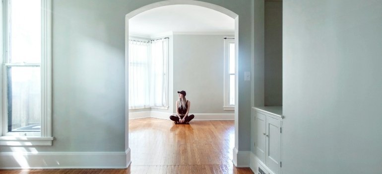 Person sitting in an empty home