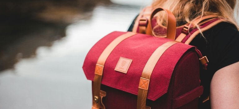 A woman with a backpack.