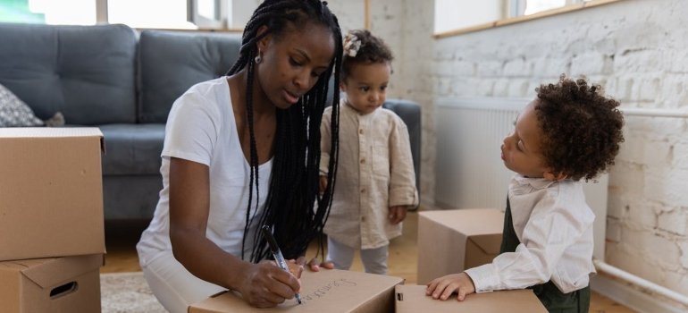 Adults and kids getting ready for a move