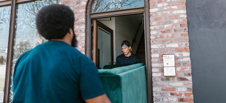 Movers carrying a couch