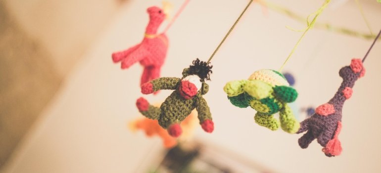A picture of three toys hanging on the wall