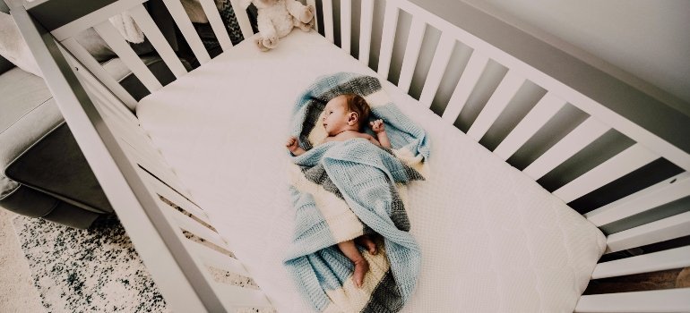a baby lying on the bed
