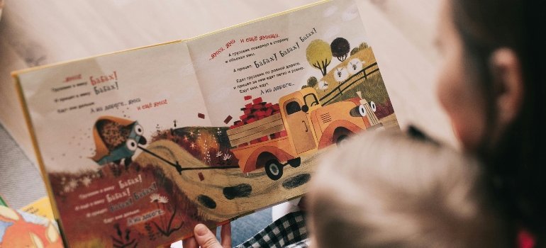 a girl reading and thinking how to pack a nursery for a long-distance move