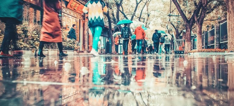 people walking during the rain