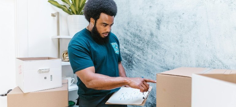 a man counting the boxes