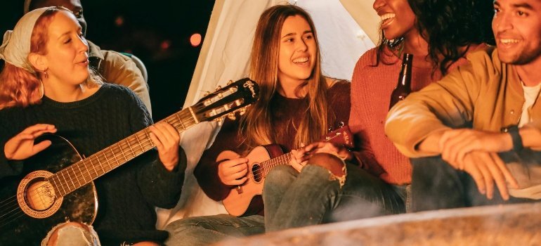 young people playing guitar
