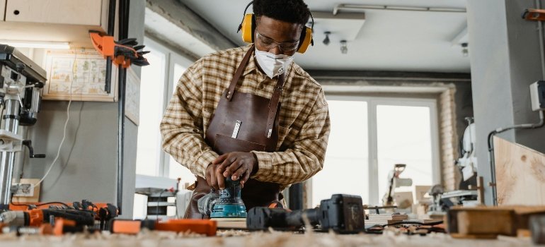 a man resolved to protect wooden furniture during a move