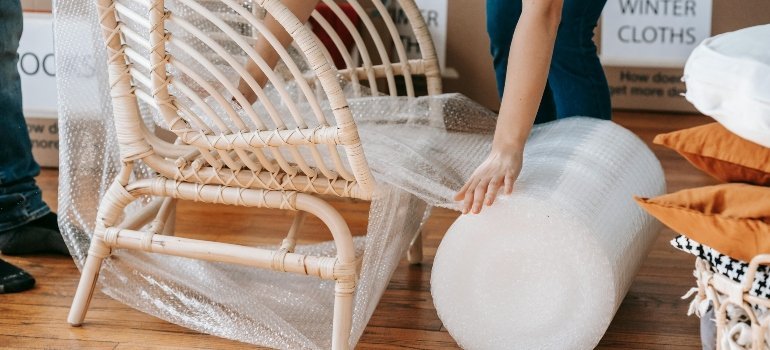 a woman packing the chair