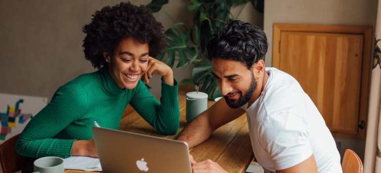 Couple looking at a laptop