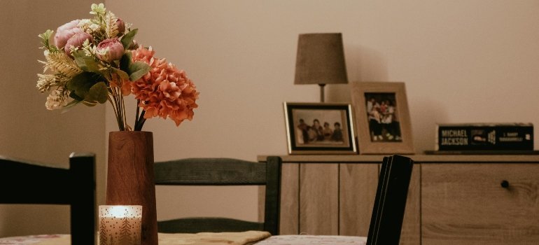 Cozy Dining Room with Floral Centerpiece and Candle