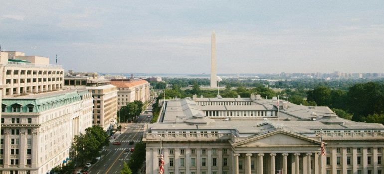 Grey concrete buildings highlighting the importance of elevator reservations during a DC move