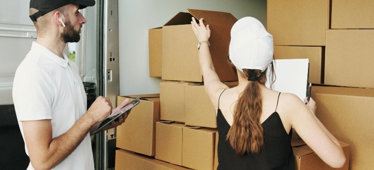 Man and Woman Checking the Packages