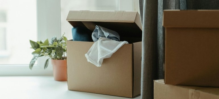 Brown Cardboard Box With White Paper