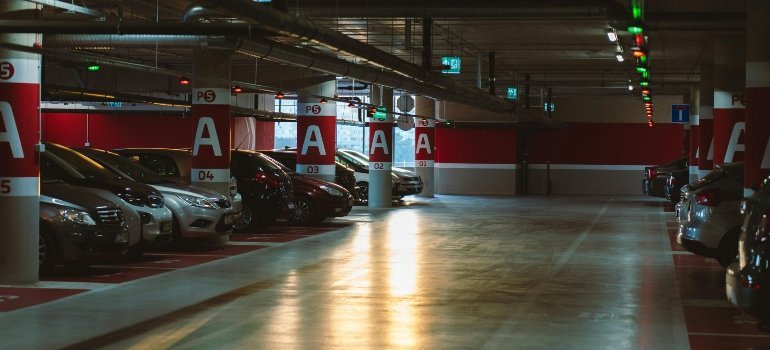 Renting in Alexandria with cars parked on a red-level parking garage, highlighting common residential parking conditions