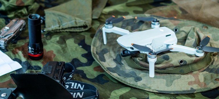 Compact Drone on Camouflage Military Gear