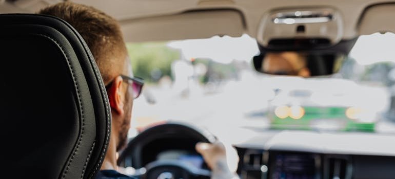 Man driving a car.
