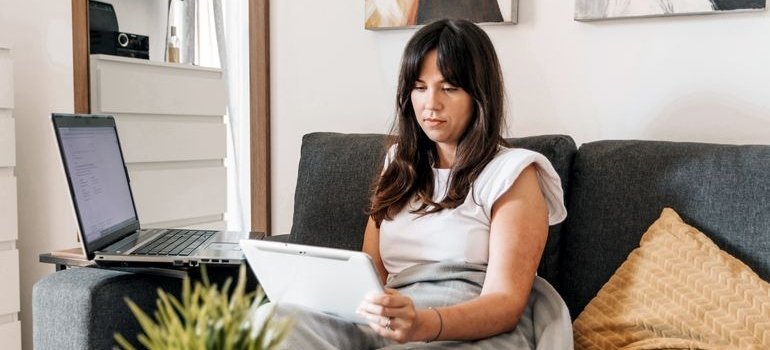 Woman looking up moving trends in Maryland on her tablet.