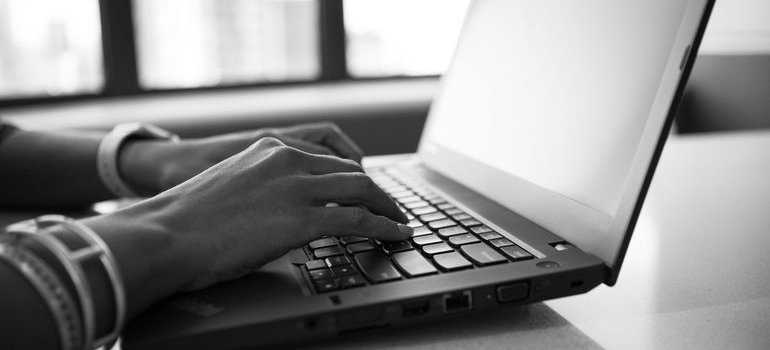Person researching moving from Northern Virginia to Maryland on their laptop.