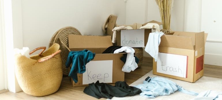 Decluttering boxes filled with clothes.